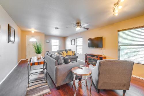 a living room with a couch and chairs and a tv at Private Yard and Patio Fort Worth Family Home in Fort Worth