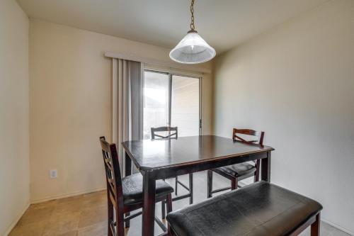 a dining room with a table and chairs and a window at Private Yard and Patio Fort Worth Family Home in Fort Worth