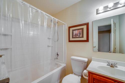 a bathroom with a tub and a toilet and a sink at Private Yard and Patio Fort Worth Family Home in Fort Worth