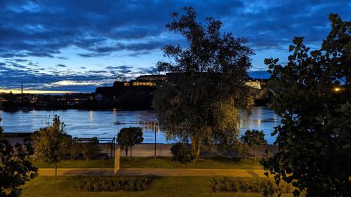 a view of a river at night at Center, Private Garage, Danube & Fortress, 3 bdrm 2 bath in Novi Sad
