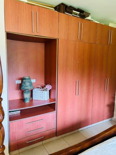 a large red cabinet with a lamp in it at Altos del Maria -mountaine views in Sorá