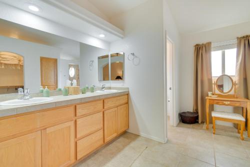a bathroom with two sinks and a mirror at Patio, Views and Boat Parking Lake Havasu Home! in Lake Havasu City