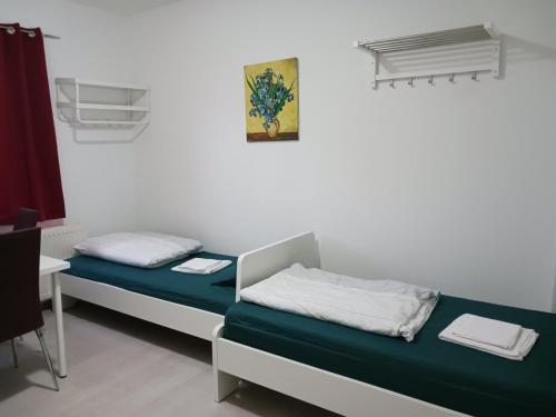 a hospital room with two beds and a table at adasflats in Bremen