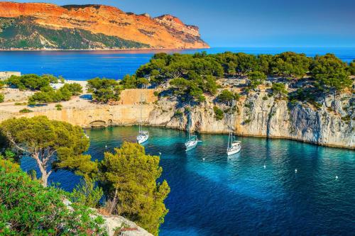 a group of boats in a body of water at Sweet Calanque - Host Provence in Cassis