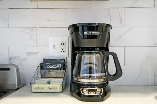 a black coffee pot sitting on a kitchen counter at 1BR Homey Apt in Irving Park - Troy 2 in Chicago