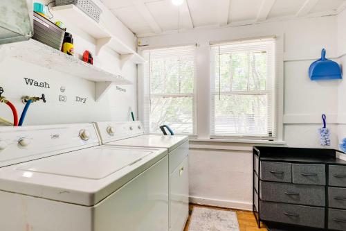 a white laundry room with a washer and dryer at Pet-Friendly Craig Townhome with Deck! in Craig