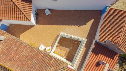 an overhead view of a house with a roof at CASASUPERTUBOS - Óbidos in Óbidos