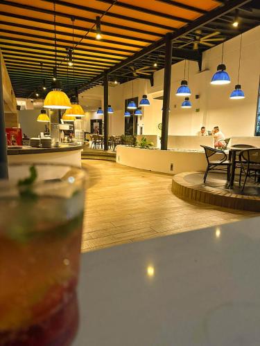 a close up of a drink on a table in a cafeteria at Pop Art Hotel CLC Puerto Mamonal Cartagena in Cartagena de Indias