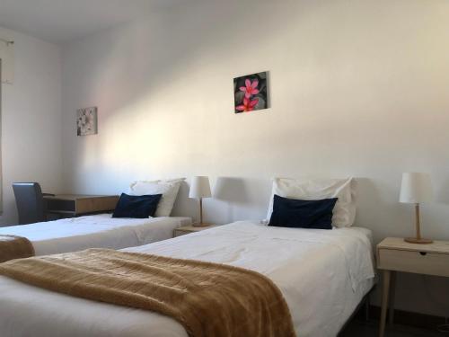 Ένα ή περισσότερα κρεβάτια σε δωμάτιο στο Santiago Guesthouse