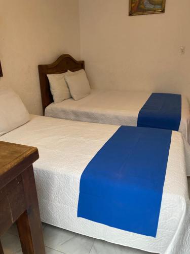 Postel nebo postele na pokoji v ubytování Hotel Nacional