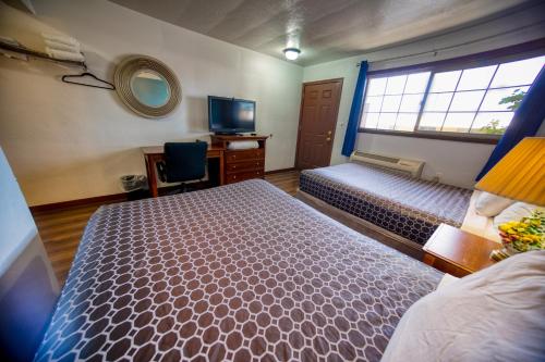 Ένα ή περισσότερα κρεβάτια σε δωμάτιο στο Budget Inn