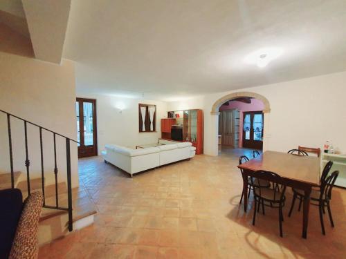 a living room with a table and a couch at Villa Caini in Perugia