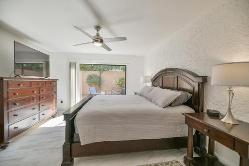 a bedroom with a bed and a ceiling fan at Private Patio, Close To Pool & Clubhouse Walkable in Scottsdale