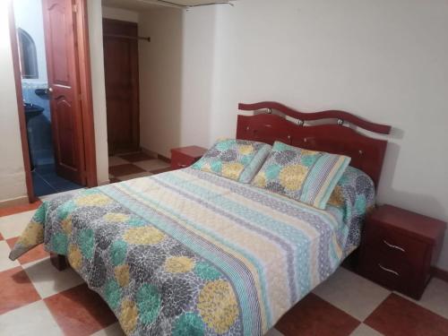 Una cama o camas en una habitación de Hospedaje Rodal
