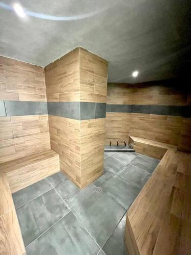 a empty room with wooden walls and a room with at Boca de cielo 504 / Vista al mar in Mazatlán