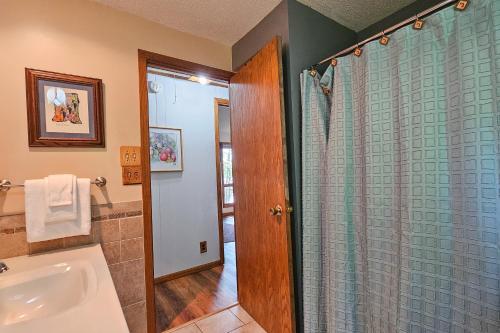 a bathroom with a shower and a bath tub at Artist's Cove in Manitowish Waters
