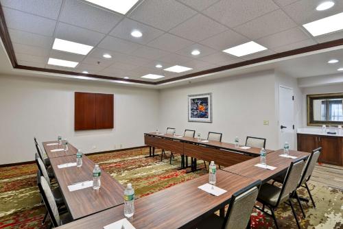 a conference room with tables and chairs and a podium at Hampton Inn Albany-Wolf Road in Albany