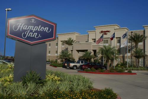 a sign for a hampton inn in front of a parking lot at Hampton Inn Orange in Orange