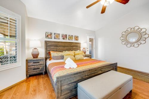 a bedroom with a large bed and a window at Pretty Peoria Place in Peoria