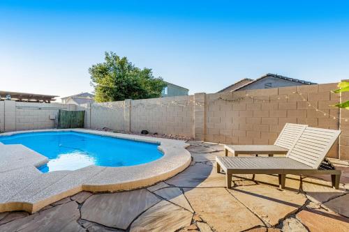 a backyard with a swimming pool and a bench at Pretty Peoria Place in Peoria