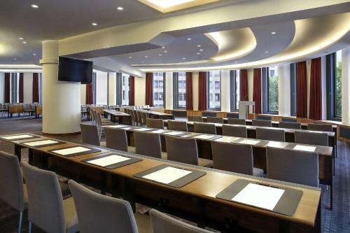a conference room with a long table and chairs at Dorint Kurfürstendamm Berlin in Berlin