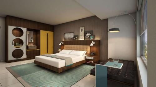 una camera da letto con letto e tavolo di Hilton Buena Park a Buena Park