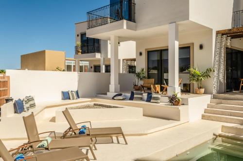 an image of a house with a swimming pool at Casa Gallo, Heated Pool, Exclusive Beach & Great Location in Cabo San Lucas