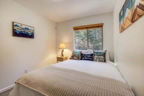 a bedroom with a large bed and a window at Tahoe Snowbird Retreat in Stateline