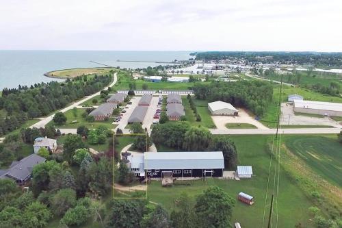 an aerial view of a farm with a large building at The Silos in Kewaunee