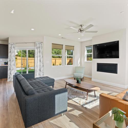 a living room with a couch and a table at Newly Built Murphys Modern Retreat in Murphys