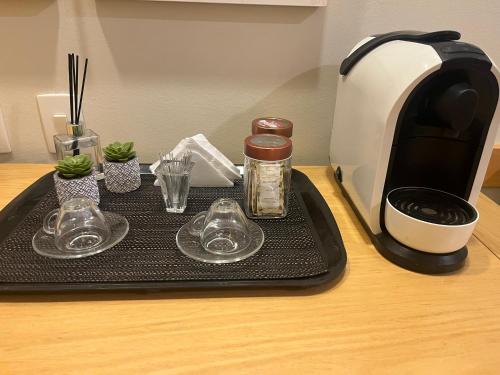 Kemudahan buat kopi dan teh di Quarto de hotel de luxo Congonhas