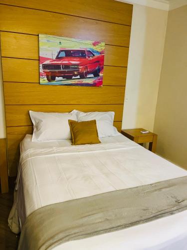 Katil atau katil-katil dalam bilik di Quarto de hotel de luxo Congonhas