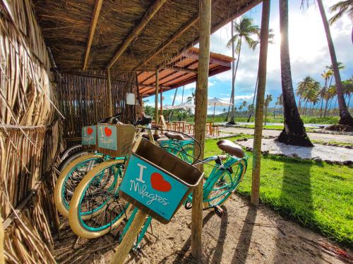 a group of bikes parked next to a building at Taboo Milagres in São Miguel dos Milagres