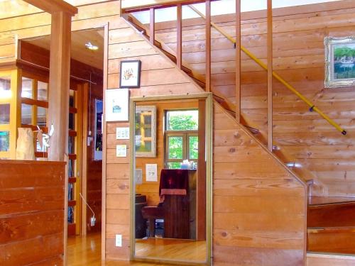 a wooden house with a staircase in a room at Minamitsuru-gun - Hotel / Vacation STAY 45545 in Yamanakako