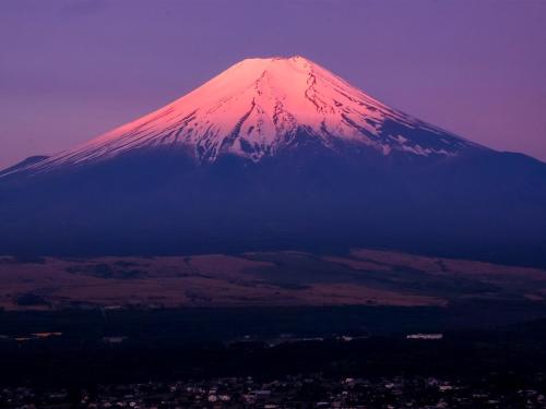a snow covered mountain with a city in front of it at Minamitsuru-gun - Hotel / Vacation STAY 45545 in Yamanakako