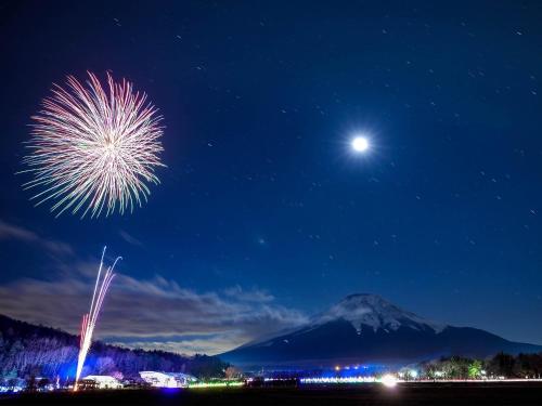a fireworks display at night with a mountain in the background at Minamitsuru-gun - Hotel / Vacation STAY 45535 in Yamanakako