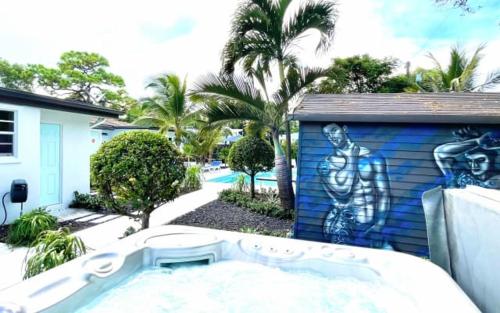 a building with a painting of a man on it at The Agustin Guesthouse - Men Only Clothing Optional in Fort Lauderdale