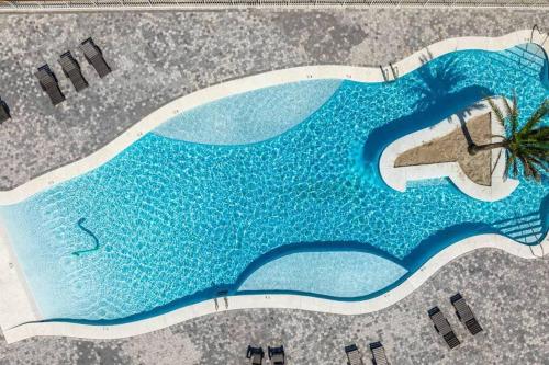an aerial view of a swimming pool with a wave at Osprey -Luxury 3BDR Beach House in Orange Beach