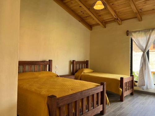 Ένα ή περισσότερα κρεβάτια σε δωμάτιο στο Cabaña Venado Tapalpa