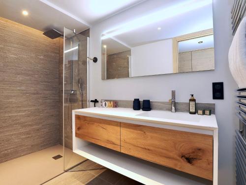 a bathroom with a sink and a shower at Chalet Courchevel 1550, 6 pièces, 10 personnes - FR-1-575-192 in Courchevel