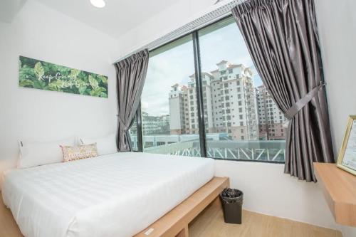 Homy Seafront Hostelにあるベッド