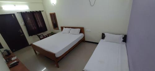 Cama o camas de una habitación en Teja Residency
