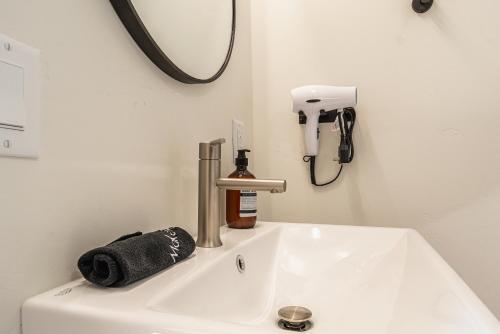 a white sink in a bathroom with a mirror at Casitas at Capitol Reef in Torrey