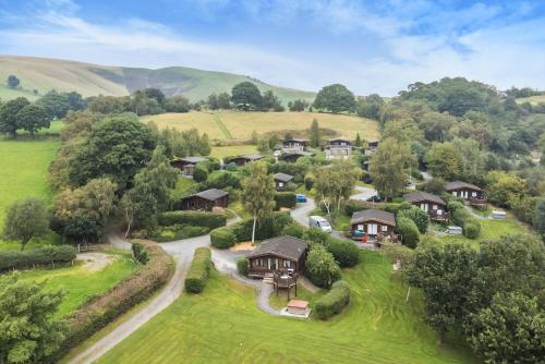 an aerial view of a home in the hills at Barn Owl Lodge in Rhayader