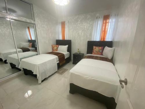 Postel nebo postele na pokoji v ubytování Luxury 3 bed apartment in Santiago De Los Caballeros