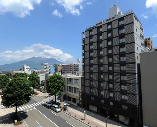 a view of a city with a tall building at Hotel Sunflex Kagoshima in Kagoshima