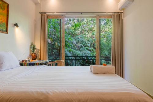 Postel nebo postele na pokoji v ubytování Shankara Accomodation Ubud