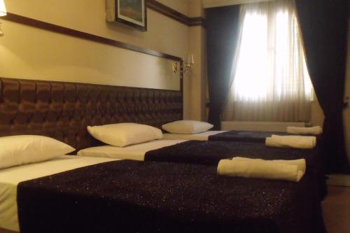 Gloria Tibi Hotelにあるベッド