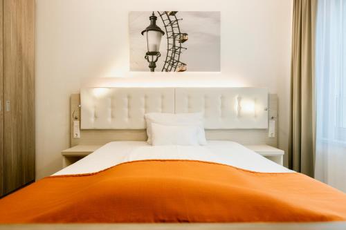 Oliver Apartments | contactless check-inにあるベッド
