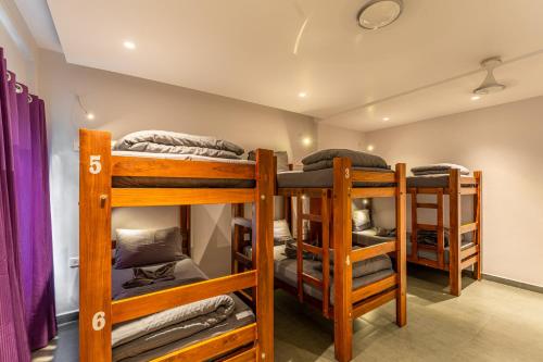 a group of bunk beds in a room at K Mansion in Munnar